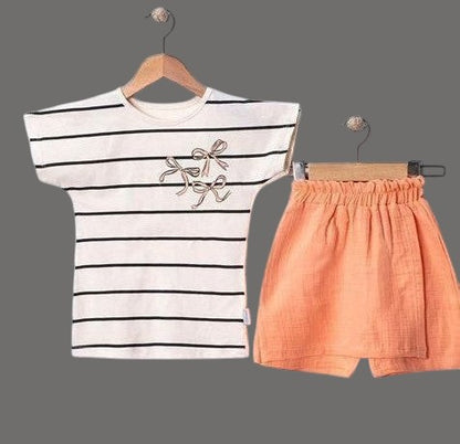 The Nile Luxuries striped t-shirt with bow detail and peach shorts set. Cotton blend, summer outfit.