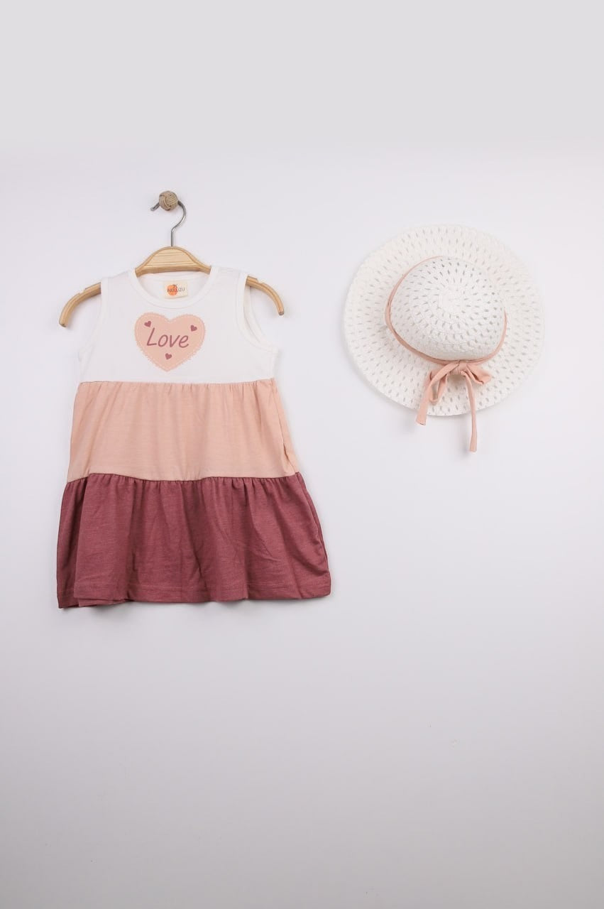 The Nile Luxuries sleeveless tiered dress with heart graphic saying "Love", color blocked in white, peach, and rose.