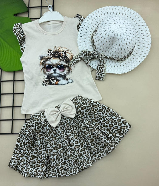The Nile Luxuries toddler girl's 3-piece outfit: sleeveless top with dog graphic, leopard print skirt, and matching hat. Cotton.