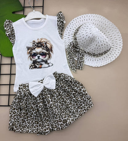 The Nile Luxuries toddler girl's white cotton outfit set with Yorkshire Terrier graphic, leopard print skirt, and matching hat.