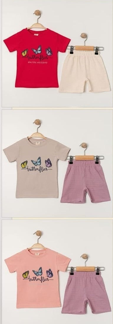 The Nile Luxuries toddler girls red cotton t-shirt with butterfly graphic and matching beige shorts. Set for comfort and play.