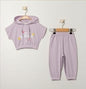 The Nile Luxuries toddler girls lavender cotton blend hoodie and joggers set with "Be Nice To Yourself" graphic.
