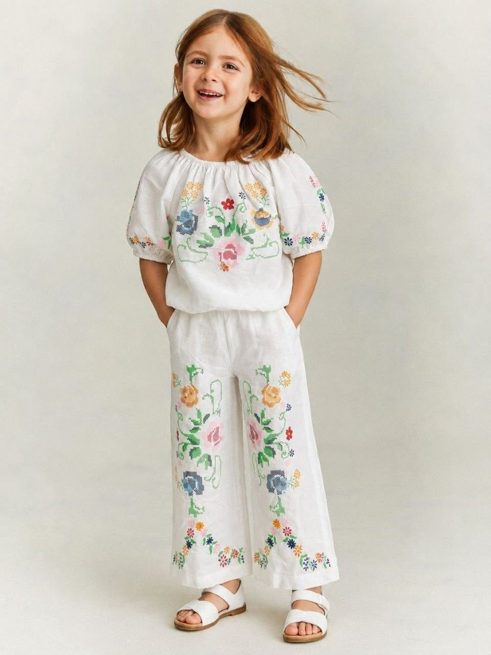 The Nile Luxuries white linen blend cropped top and wide leg pants set with colorful floral cross-stitch embroidery for girls.